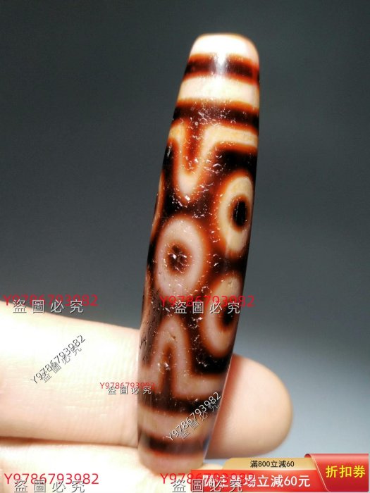七眼天珠，一顆干凈漂亮紅肉天珠。喇叭孔螺旋打孔繩子佩戴磨損勒痕明顯