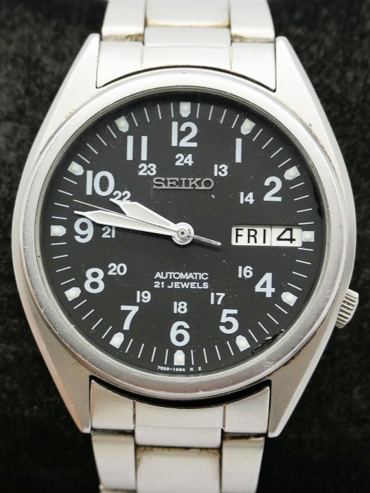 (小蔡二手挖寶網) 日本製 SEIKO 精工 黑面 21石 日星期顯示 裸空機芯 不鏽鋼錶帶 自動上鍊 機械錶 有行走 商品如圖 1元起標 無底價