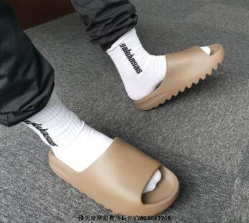yeezy slide earth brown on feet