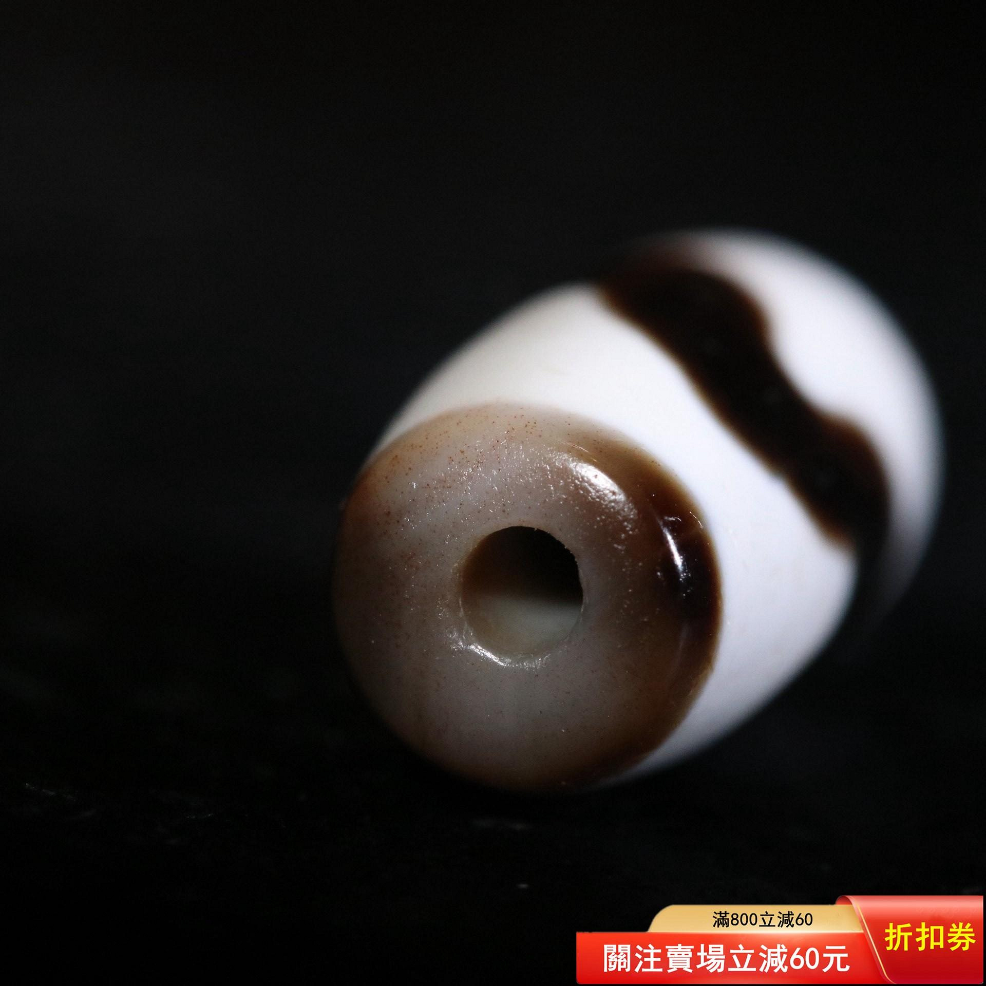 虎牙天珠尺寸22.9*11.0mm 珠型精致，質地細膩，肉質緊實，線條清晰流暢