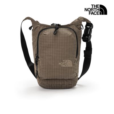 【The North Face 官方旗艦】北面男女款褐色DWR防潑水抽繩開口斜背包｜8JCD2H9